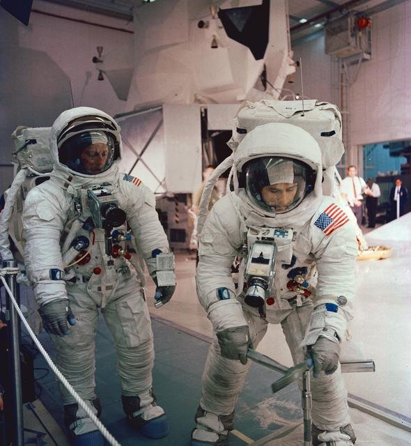 Astronaut Edwin Aldrin descends steps of Lunar Module ladder to walk on moon