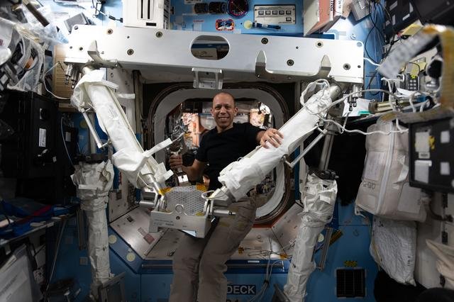 NASA astronaut Chris Williams familiarizes himself with spacewalking hardware
