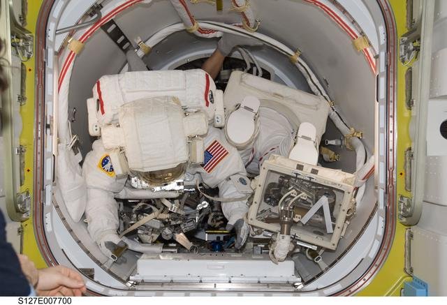 Wolf and Cassidy in the A/L during EVA-3 Preparation